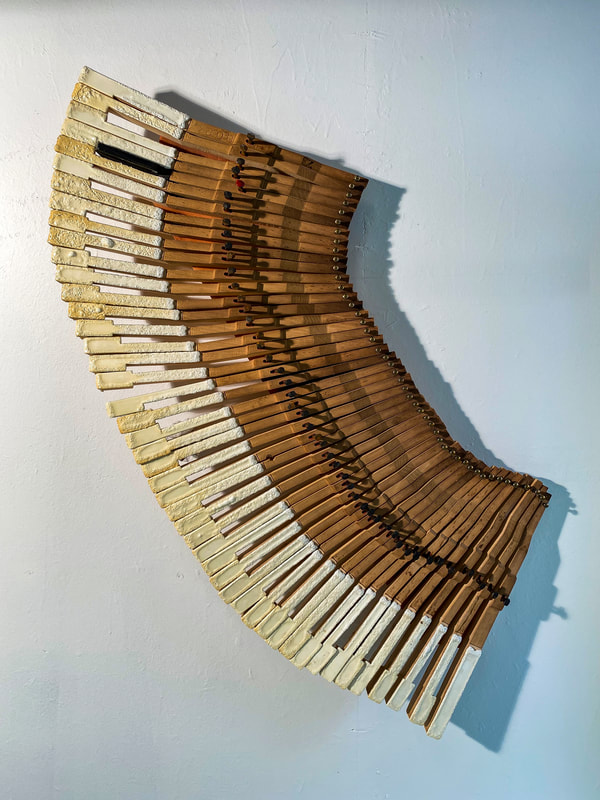 Noted Boston sculpture artist David Lee Black creates art with the theme of Black Lives Matter. 

Vertebrae

Gutting a grand piano and baking the white keys at 475 degrees for 20 minutes to combine them with a single ebony key was a journey into what it may feel like to be black in white spaces. 