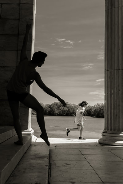 Fine art photographer David Lee Black photographs child running and male ballet dancer at Temple to Music for long distance runner exhibition. 